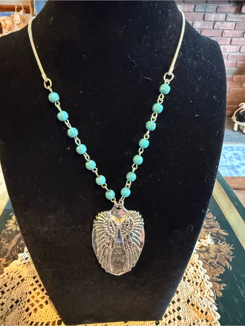 Turquoise Beaded Necklace with Silver Wing Pendant by Plunder Fly on Brave girl
